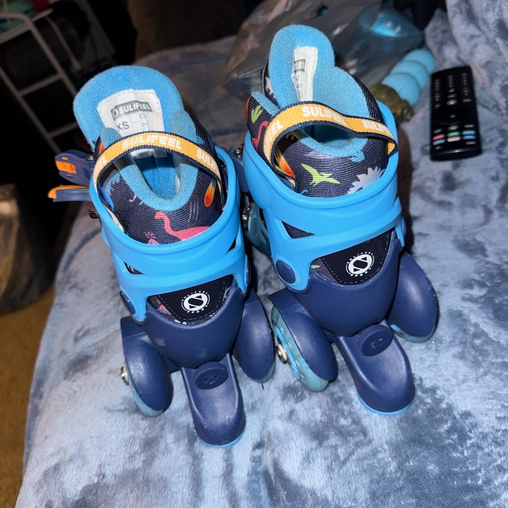 Adjustable Kids Roller Skates in Blue with Colorful Dino Print